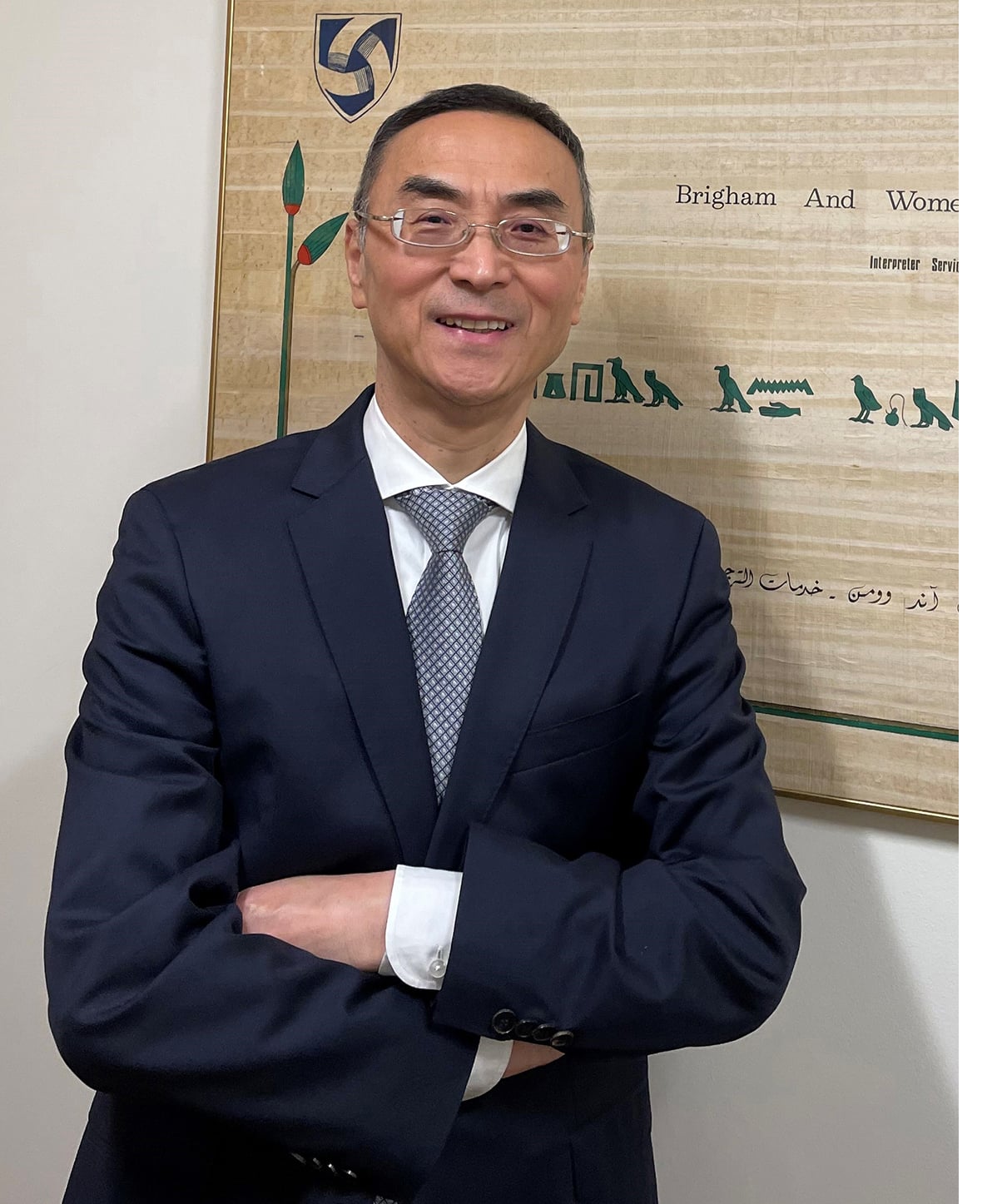Yilu Ma smiling wearing a blue suit.